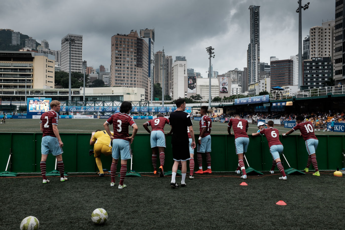 Players stretch before game time at a tournament in Hong Kong
