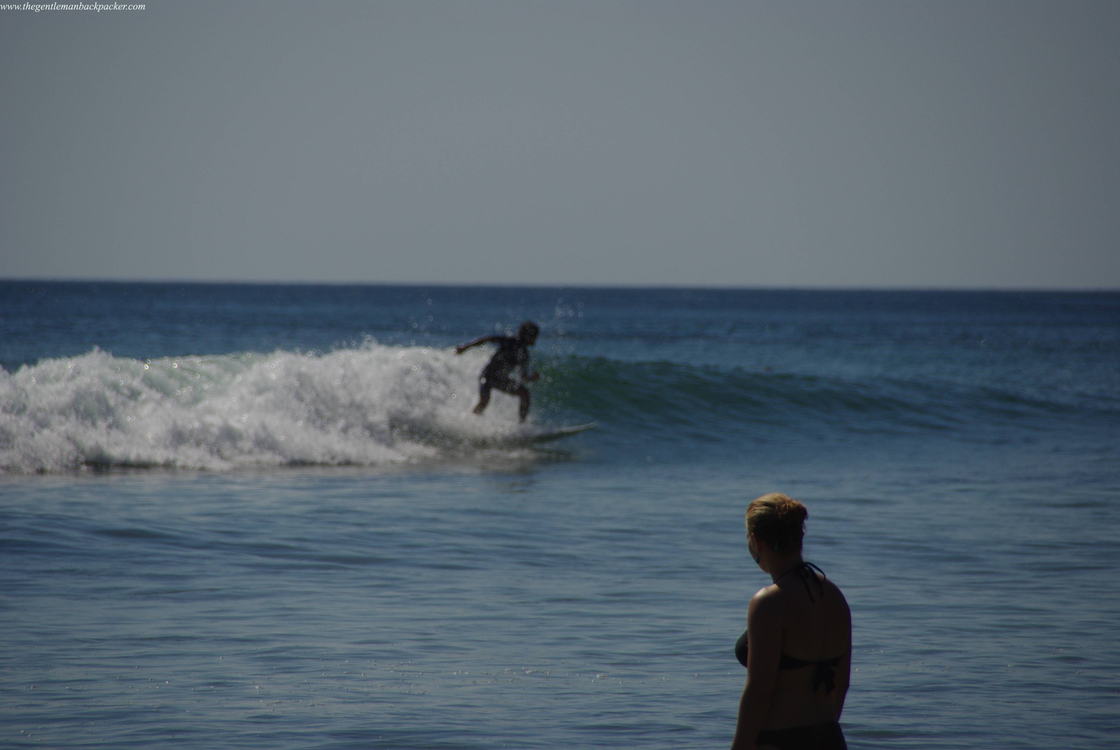 A bystander looks on, Playa Maderas